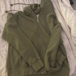This is a brandy melville green zip up. Very soft and lightweight